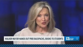 Walker mayor hands out backpacks and books to students