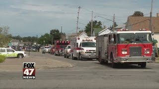 Emergency Vehicles Escort Firefighter's Body to Funeral Home