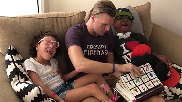 Dad modeling PODD and partner scanning with Angela