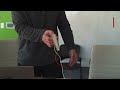 A paper-thin loudspeaker plays "We Are the Champions" by Queen