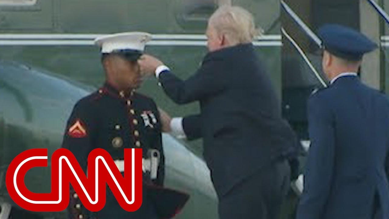 Trump stops to retrieve Marines hat