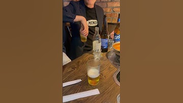 Flip trick. How to mix soju and beer. #koreanfood #koreatown #sojubomb