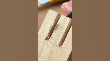 A double spline miter joint made using hand tools.