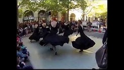 Dancers doing a tap dance with a Spanish flare.