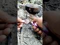 Heating a Metal Coin Using a Survival Campfire Trick