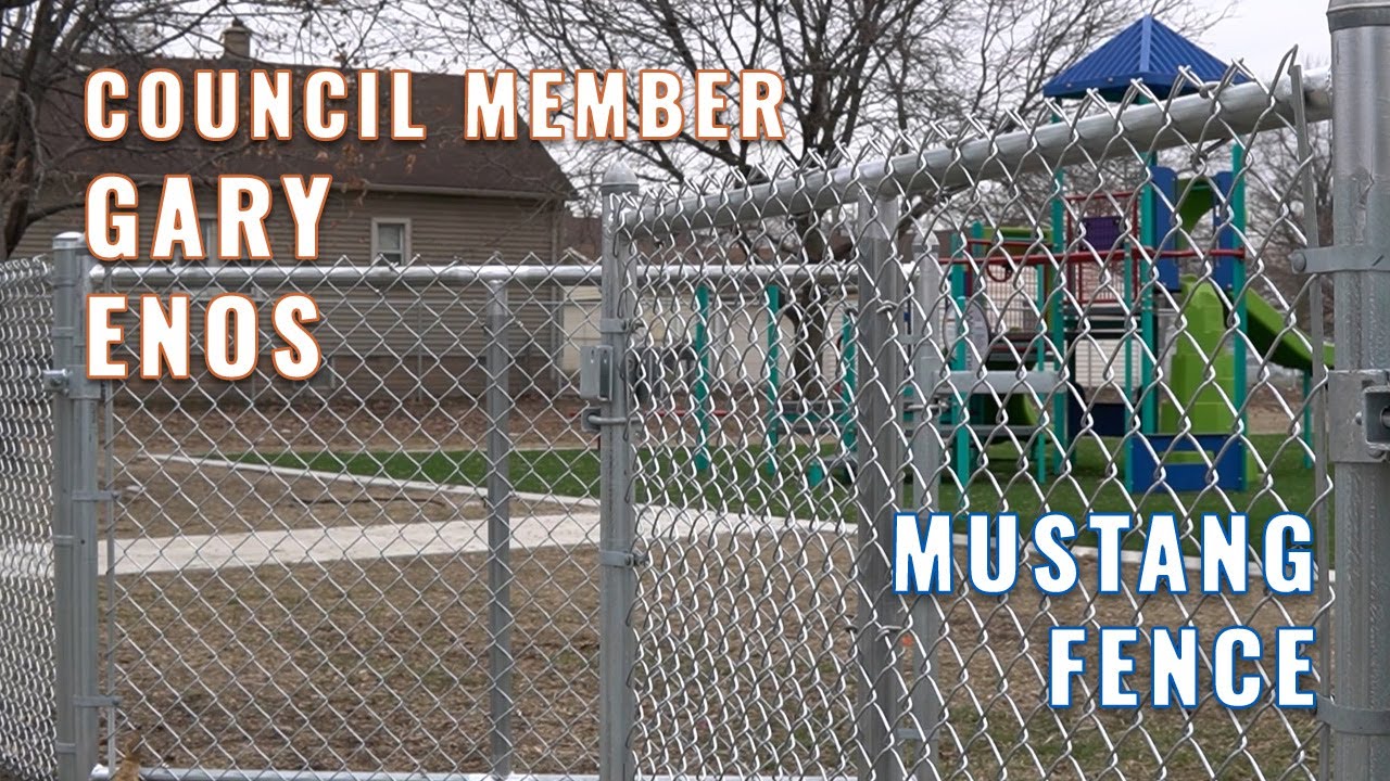 Councilman Gary Enos has a look at many fencing projects completed by