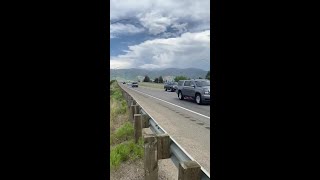 Motorcade speeds through Mining City on the interstate