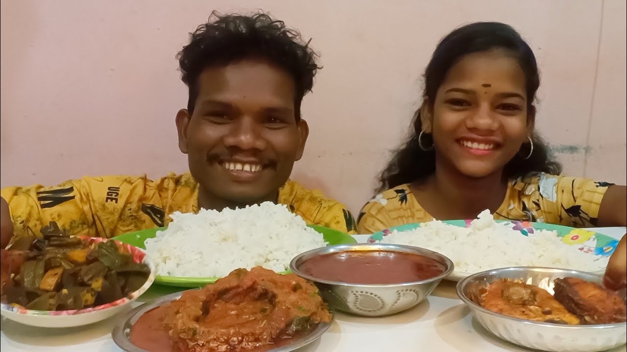 eating fish curry, bhindi fry, gravy, fish fry with rice indian food