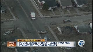 Police search for two suspects in carjacking spree