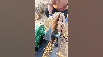 the skill of splitting wood easily using a very sharp ax machine #shorts #farming #agriculture
