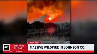 Emergency management crews battle massive wildfire