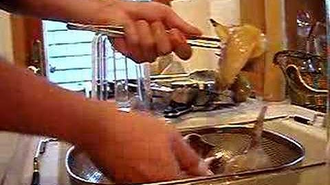 Removing a par boiled conch from it