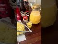 Loaded hot dogs with tomato sauce,chutney,cheese+onions.Kombucha and MangoʻOtai #food #family #yummy