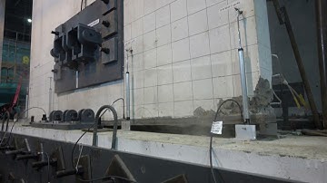Low-damage concrete building earthquake test: Wall base with grouted joint + no dampers