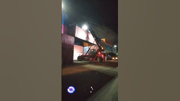 Kalmar Reach stacker with a tilting spreader for container handling