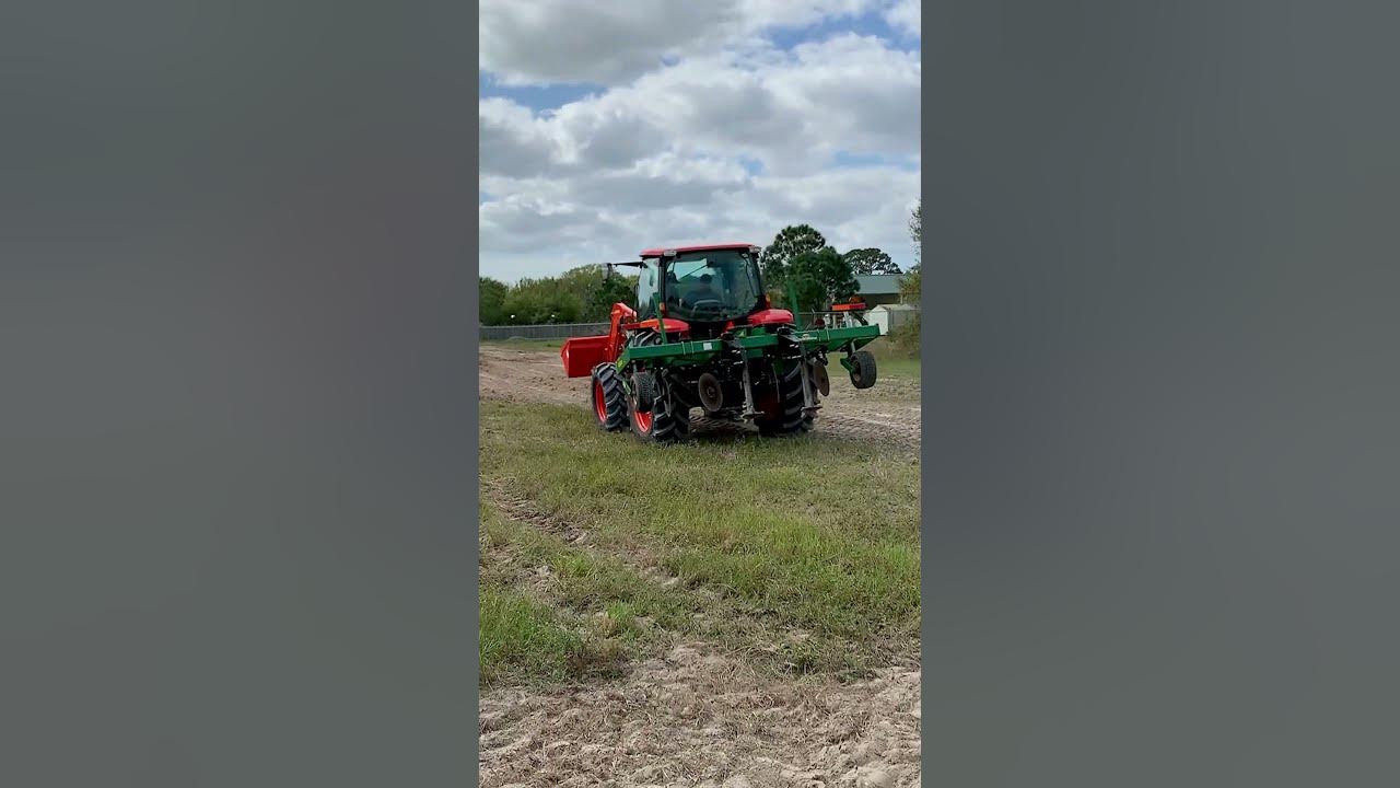 Kubota tractor pulling a subsoiler - YouTube