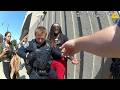 man accuses the police of racism, resists arrest, and threatens to sue the officers