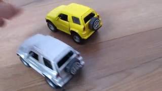Demonstration of yellow and gray Jeeps