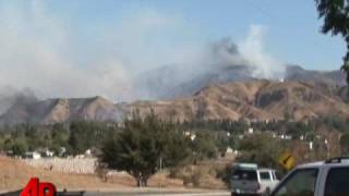 Wildfires Send Thousands Running From Homes