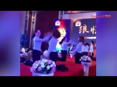 Chinese staff made to slap each other on stage at company's anniversary celebration