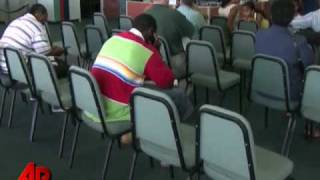 Payrolls Drop by 125K, Jobless Rate Falls