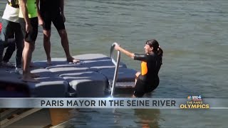 Paris mayor dips into the Seine River to showcase its improved cleanliness before Olympic events