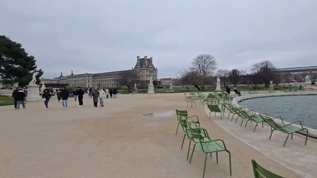 Jardin des Tuileries Park Paris France with a pond and tiny ducks 