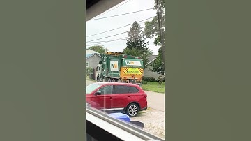 Heil half pack front loader dumping a couch 🛋️! #shorts #frontloader #wastemanagement #dethklok