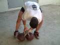 Steve Cotter Doing A Double One Arm Jerk with 2 x 32kg Kettlebells