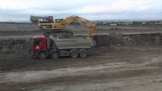 CAT 345B loading MB Actros dump truck