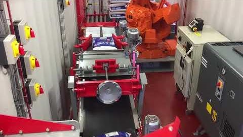 Container bag packing line with robotic palletizing
