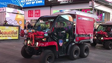 2 FDNY EMS GATORS TAKING UP FROM EMS CALL ON WEST 45TH STREET IN TIMES SQUARE, MANHATTAN, NEW YORK.