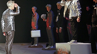 Buzz Aldrin and Bill Nye walk in fashion show