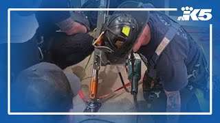 Crews rescue two people trapped in Seattle elevator