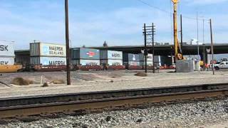 WB Amtrak & EB BNSF Stack Train Pass Each Other @ Colton CA .wmv