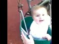 My daughter on the swings laughing back in 2014.