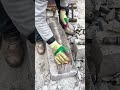 Splitting a Large Granite Block Manually Using a Hammer and Metal Wedges