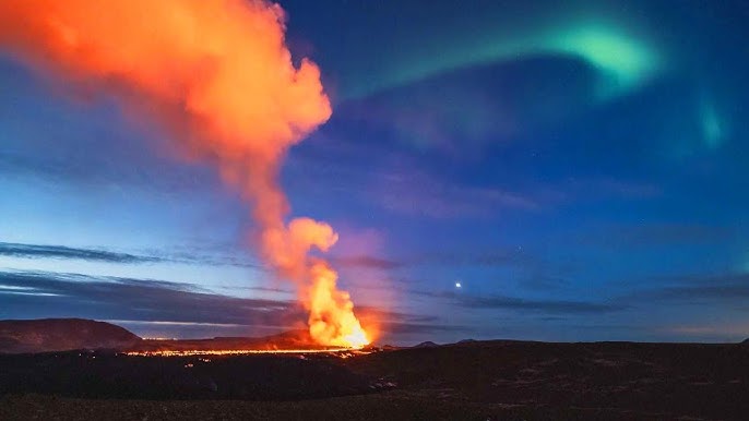 Aurora Borealis Dances Over Volcano Eruption In Iceland