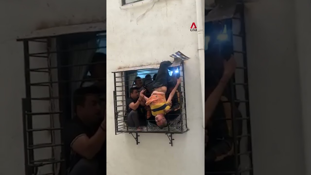 Sleeping man who fell from 10th floor flat in India rescued after getting caught in grilles