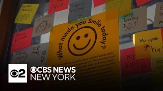 Woman's attempt to spread happiness at work grows into network of positivity