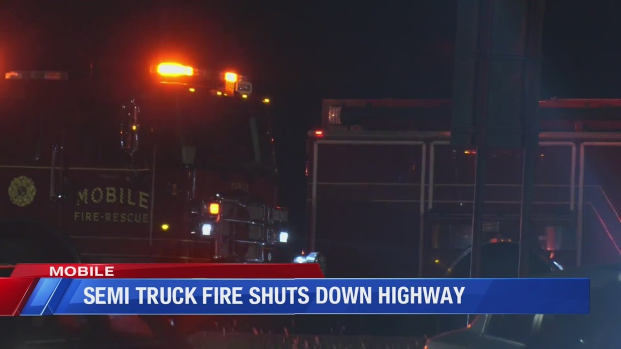 Semi truck fire in Mobile shuts down highway - YouTube