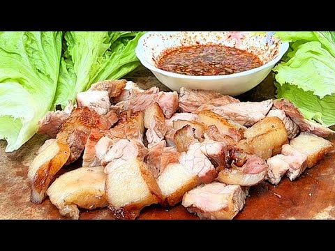Grilled Crying Tiger beef with bitter dipping sauce and big bites of sticky rice, absolutely deli...