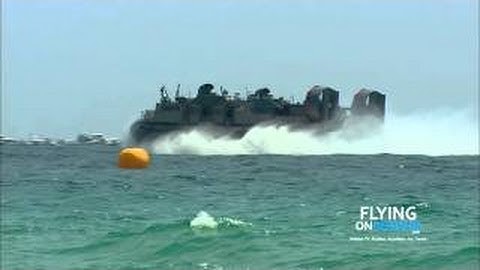 US Navy LCAC Hovercraft Land on Beach, Unload Equipment, Return to Aircraft Carrier