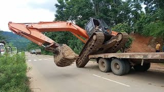 excavator unloading । unloading excavator off trailer। poclain machine trailer unloading ।