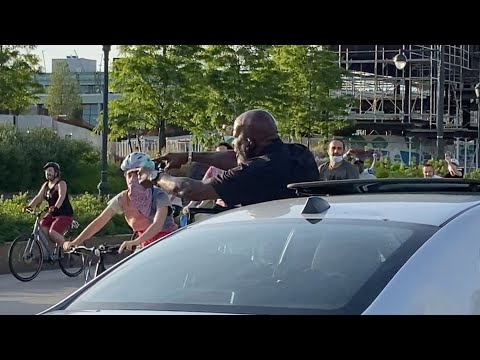 Man Cheers For Protesters During Bicycle Rally in New York