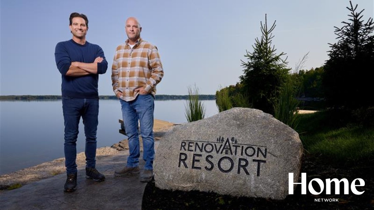 Scott and Bryan standing next to a rock with the title of the show displayed