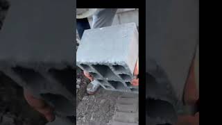 The Process Of Installing Large White Bricks For Making Warehouse Building Walls