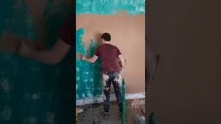 Apprentice bonds out full wall for render mesh to go on
