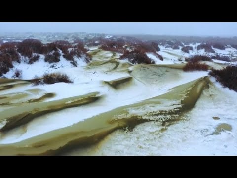 Snow covering Taklimakan desert in northwest China