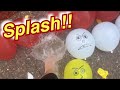 Popping some red yellow and White water balloons